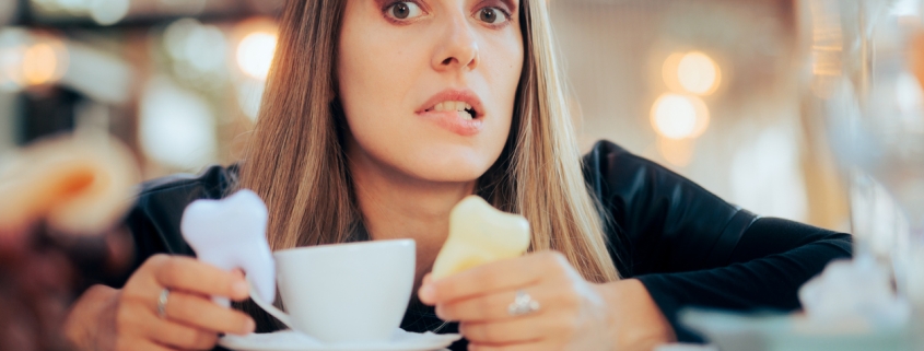 Worried Woman Having Teeth Coloration problems from Coffee